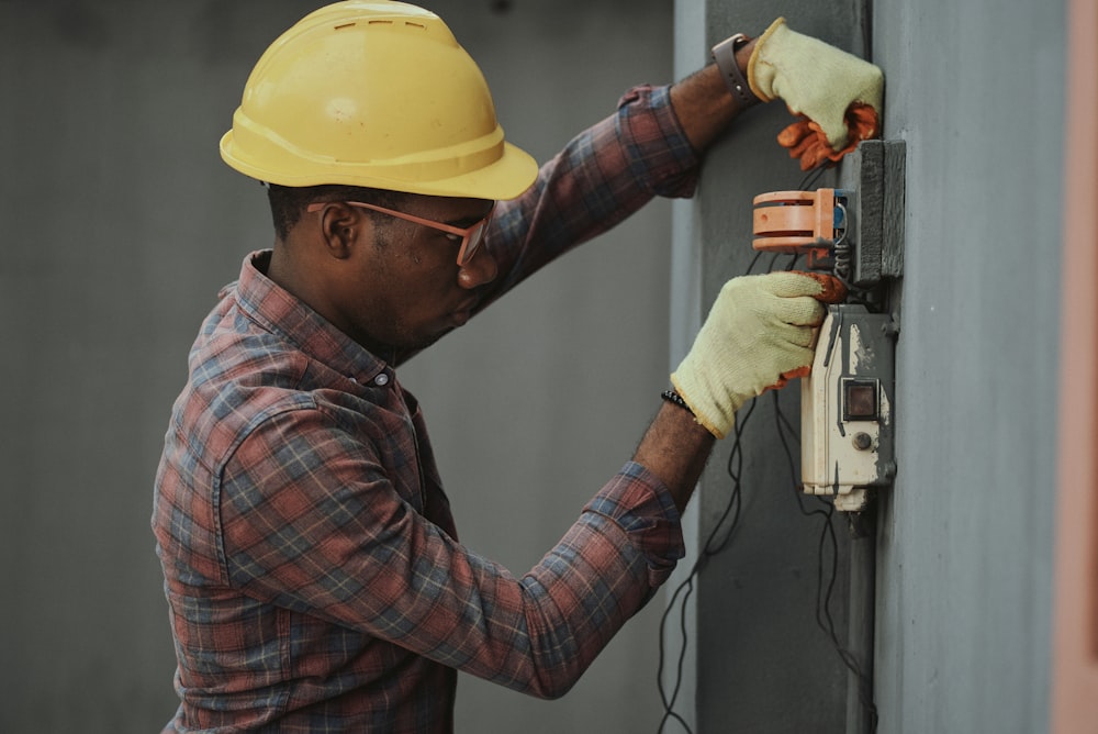 Electrician repairing a switchboard